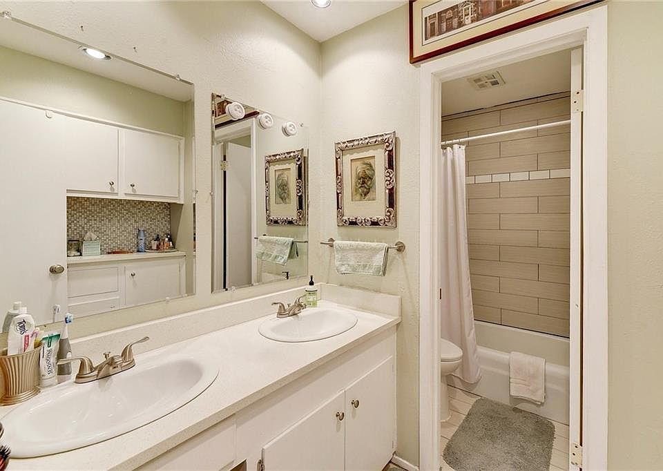 Updated Double Sink Vanity with Separate and Shower/Toilet Area.