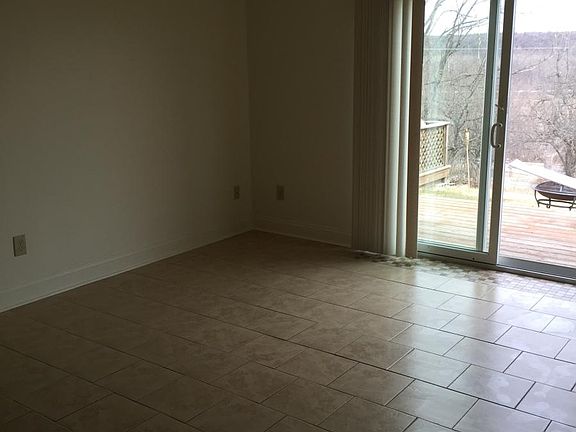 Living room with sliding glass doors to deck