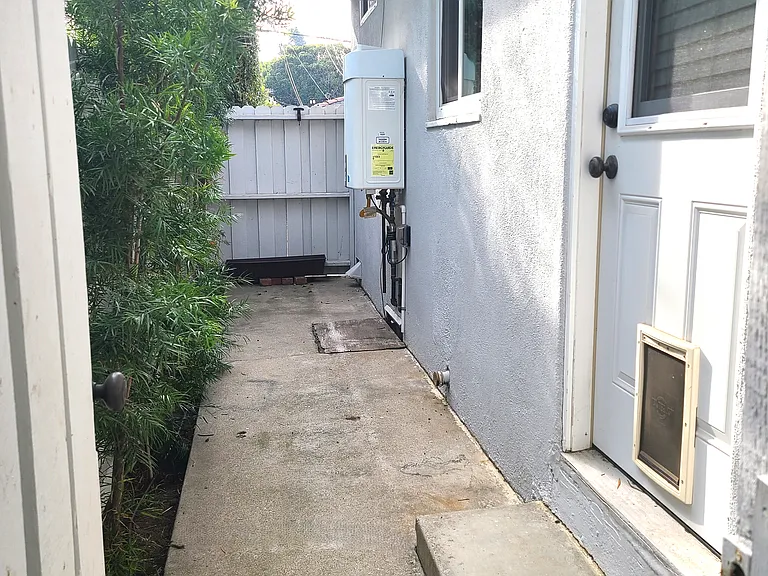 Gated back patio. Back door has a pet door.