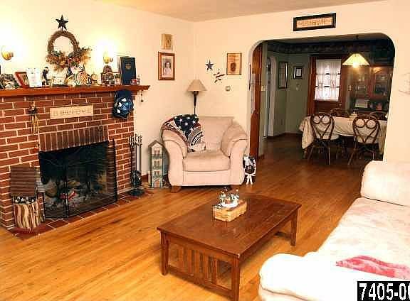 Charming Fireplace, wood floors, archways, and more