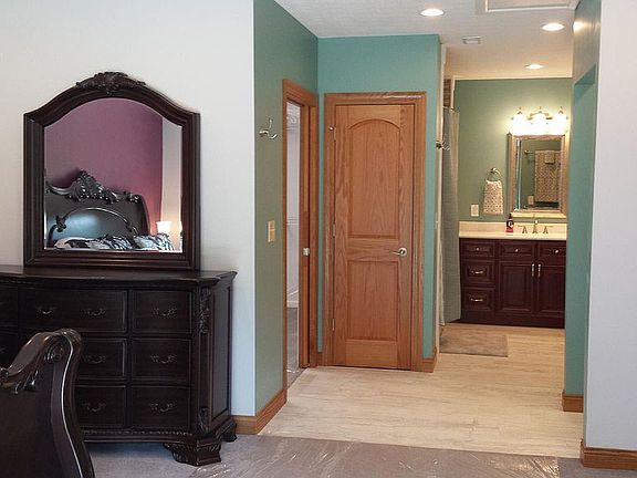 Master Bedroom with Large Master Bath Suite includes 6' Heated Jacuzzi Tub with 4 Head Shower. Corian His and Hers Sinks and Counter Tops, Separate Large Walk-In Shower with 3 Shower Heads.