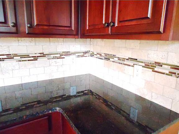 SPECIALTY BACK SPLASH AND GRANITE COUNTERTOPS