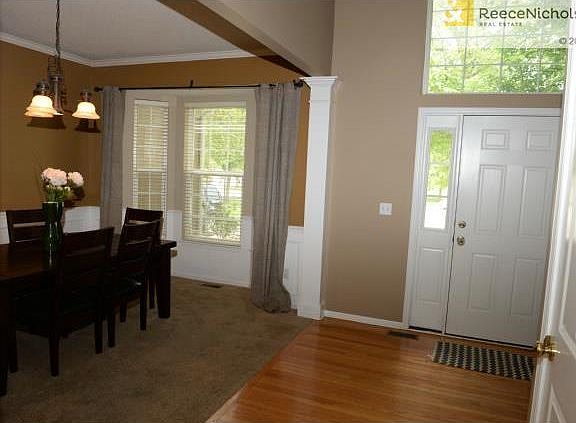 Front entry with gleaming hardwood floor and plenty of sunlight