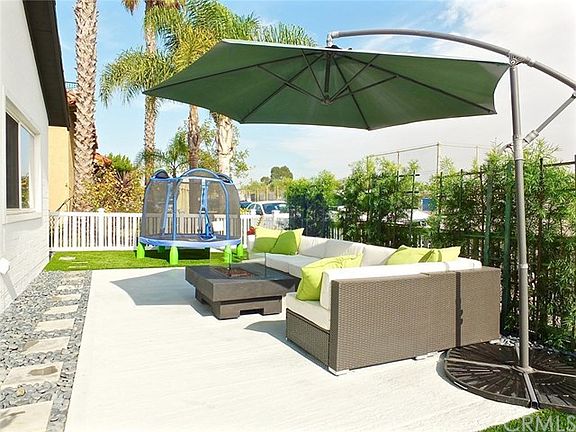 Beautiful landscaping with a large patio area for entertaining or playing with the kids.