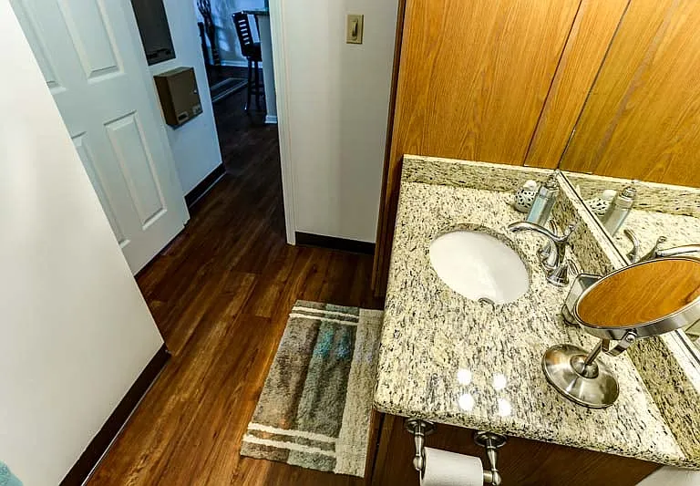 Full-Size Vanity in Bathroom with Large Mirror