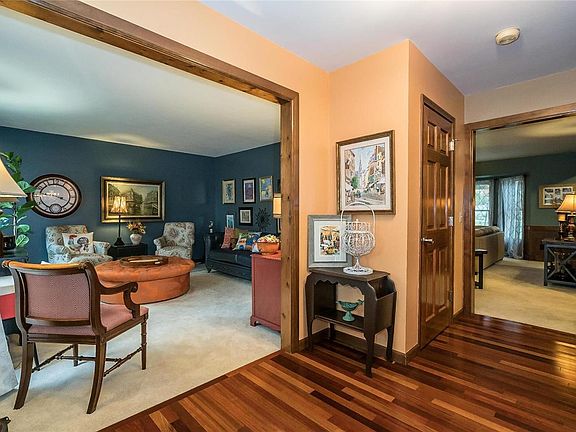 Generous sized Entry with Cherry hardwood Floors, coat closet and trim work.  I am loving the style of that Study/Formal Living Room!  Follow the short hallway past the coat closet to the Family room with built in book shelves and fireplace.