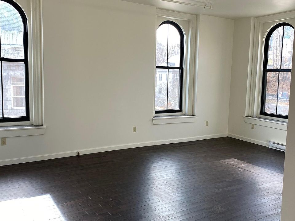 Living room with view of river and city park.