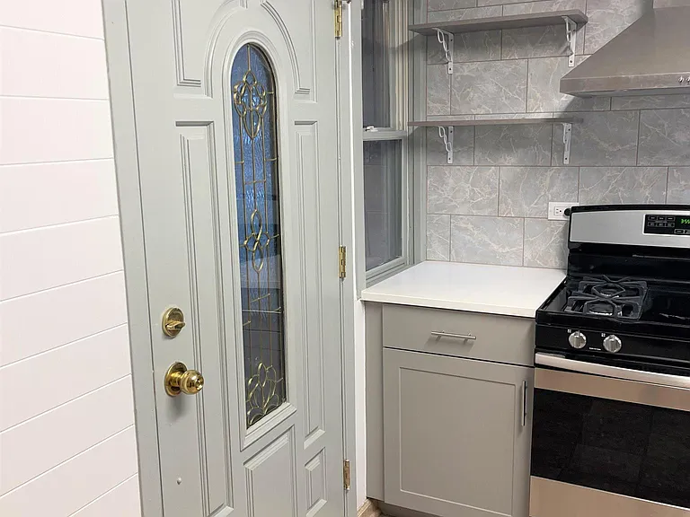 Open Shelving Next to Brand New Stove