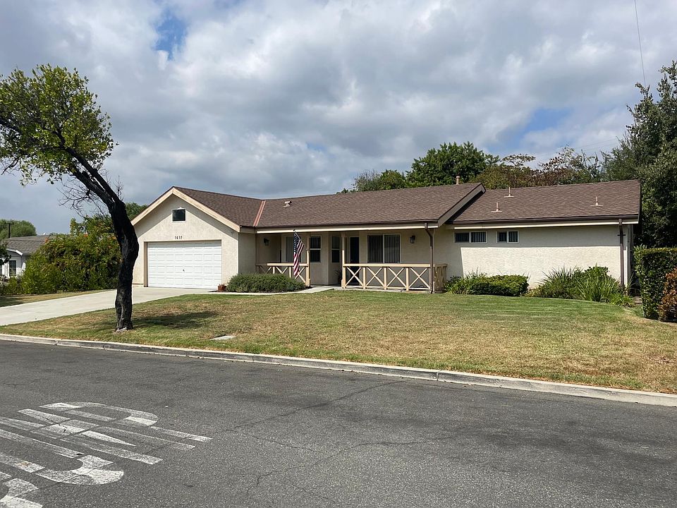 Street view - front porch, note oversized 2 car garage