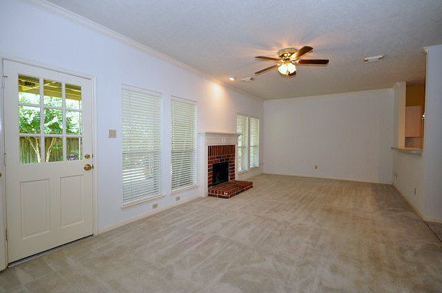 22x12. Family room. Ceiling fan, recessed light. Brick fire place. 