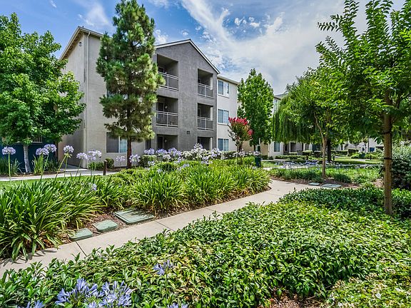 Balconies overlook lush courtyards