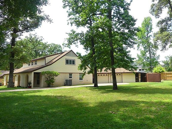 The home is sited on 1.5 wooded lots, with large side yard. Sprinkler system covers entire yard!