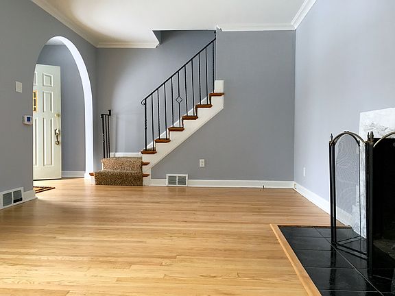 Living room with newly refinished wood floors.