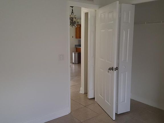 Bedroom door facing the kitchen