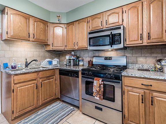 Nice kitchen with custom cabinets, granite counters, and VERY rarely used stainless steel appliances
