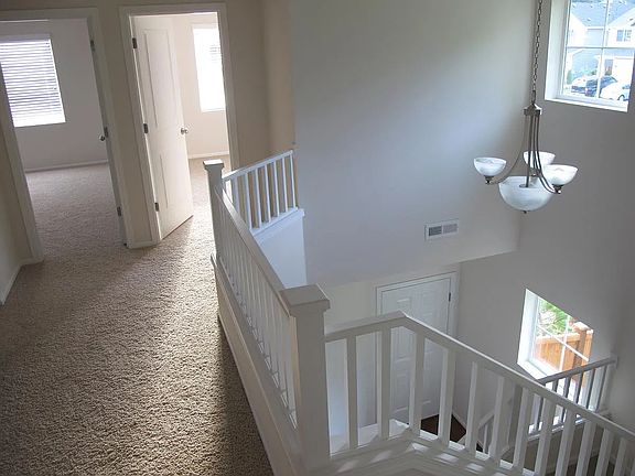 Upstairs hallway, front entryway below.