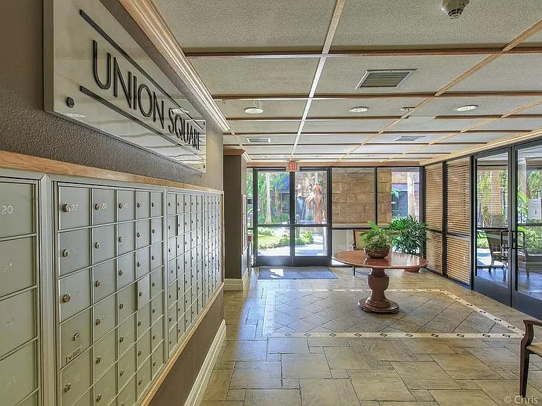 Lobby. Gym is on the left, community room on the right. View of the fountain straight ahead.