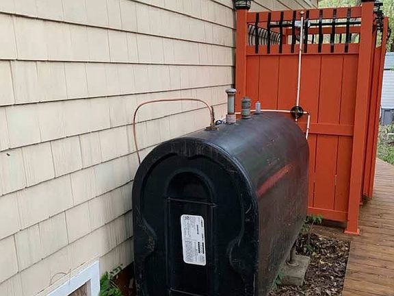 Above ground oil tank and outdoor shower