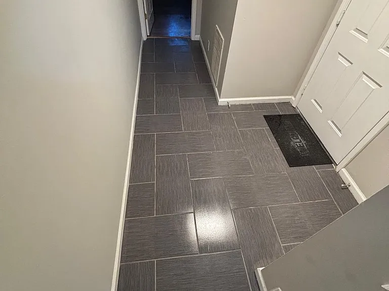 Garage entry and walkway to bonus room
