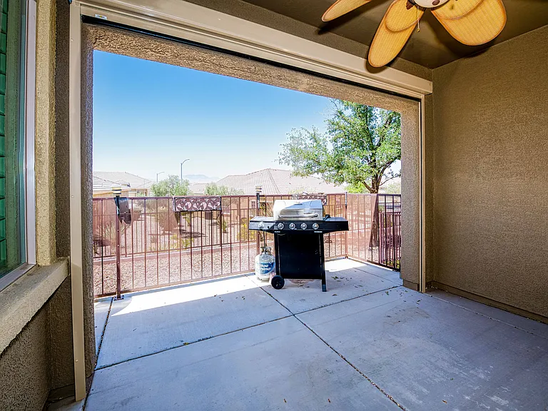 Enclosed Patio with view, BBQ, ceiling fan.