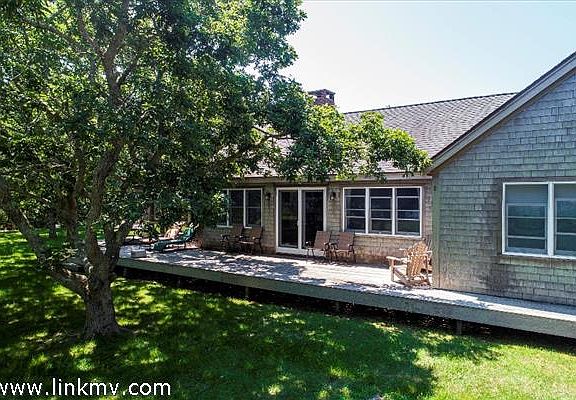 There is ample outdoor space to enjoy views of the Great Pond.