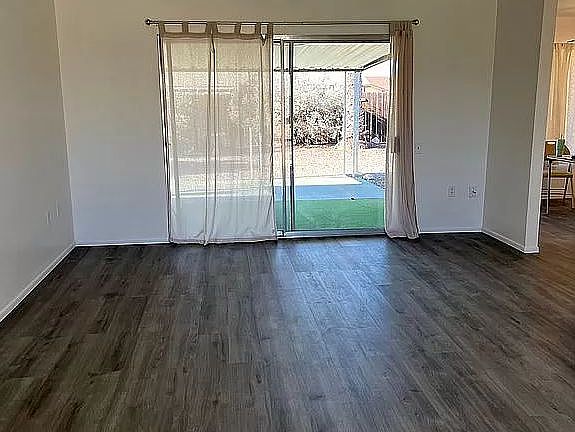 Living room looking towards sliding doors to the back yard.