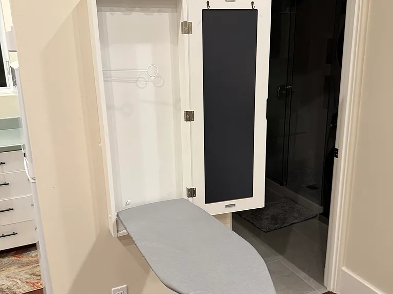 Included ironing board and iron.