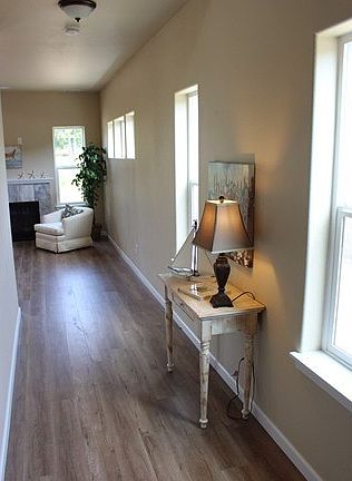 Entry hall with laminate floors and white painted trim.