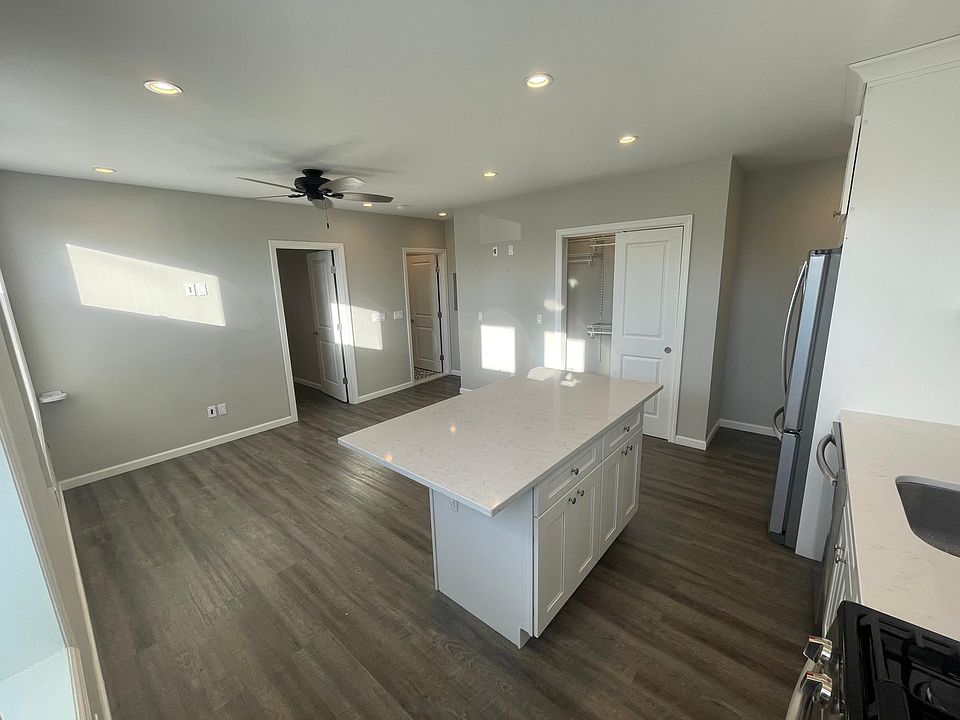 Over hang in kitchen island is around three sides for lots of stools.