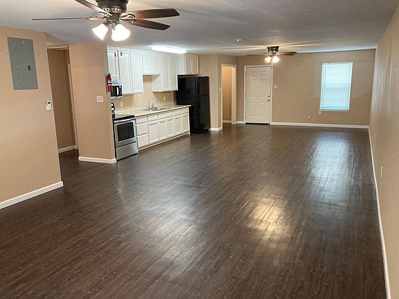 Spacious open floor plan living room, kitchen, dining.