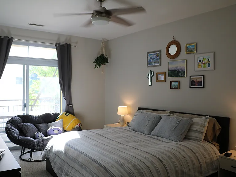 Primary bedroom retreat with ceiling fan and beautiful natural light