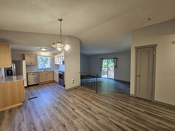 Open concept dining, kitchen and living room.