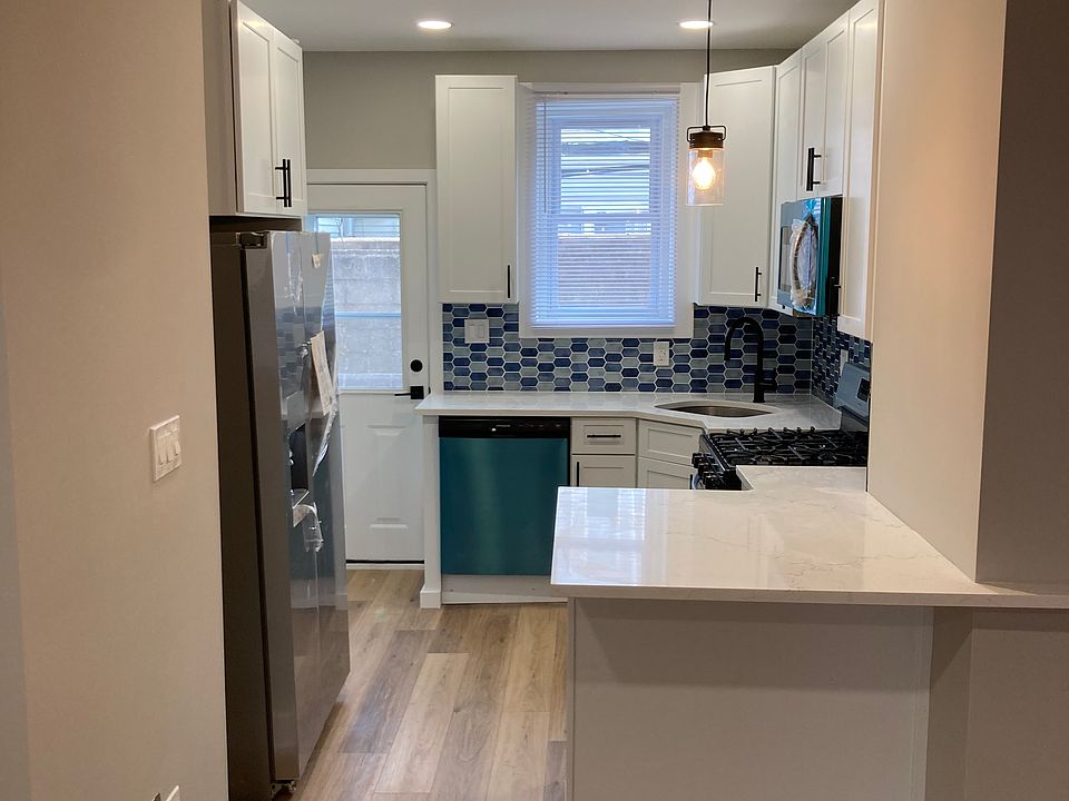 Brand new open kitchen with stainless steel appliances and abundant cabinet space