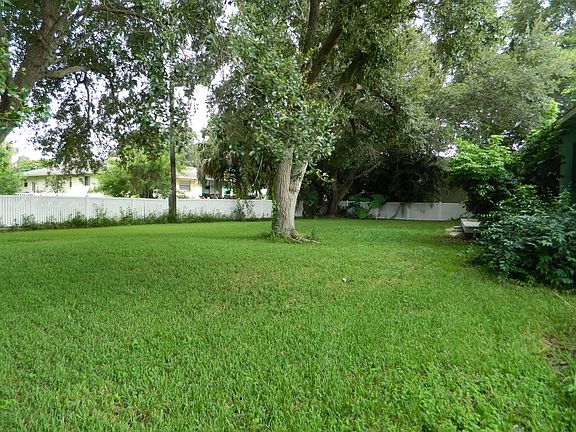 large fenced in yard with 12 ft gate