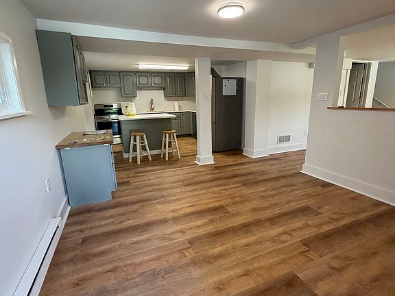 Dining room as you walk into the front door which leads to the kitchen straight ahead and the living room to the right