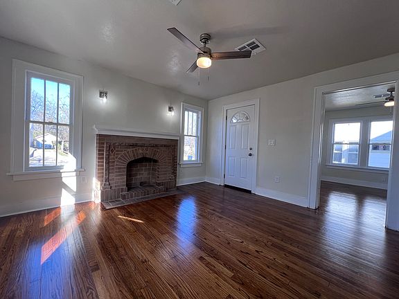 Mock fireplace below wall sconce