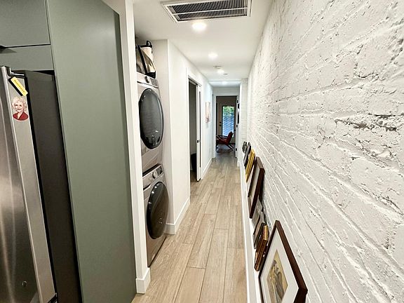 hall toward den, bath, bedroom and patio