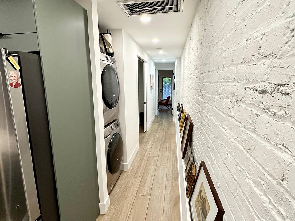 hall toward den, bath, bedroom and patio