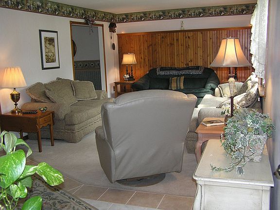 LARGE formal living room with lots of light.