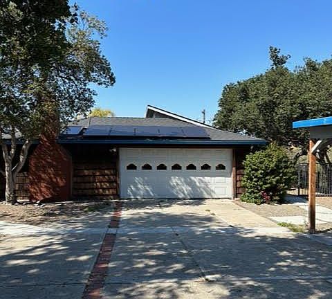 Front of home and garage; separate car port for up to 3 vehicles