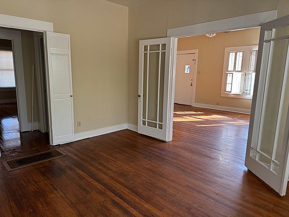 Dining room adjacent to Living room with gorgeous hardwood floors
