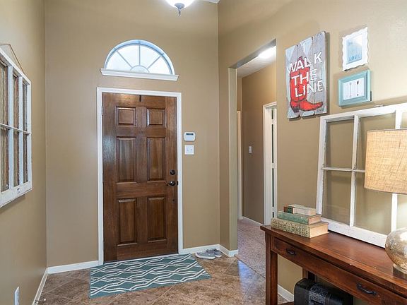 Step inside and instantly feel the warm of this home! An arched window allows the natural light to enter the space!