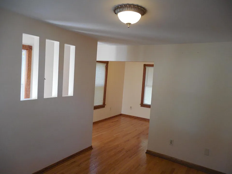LIVING ROOM LOOKING TO OFFICE AREA