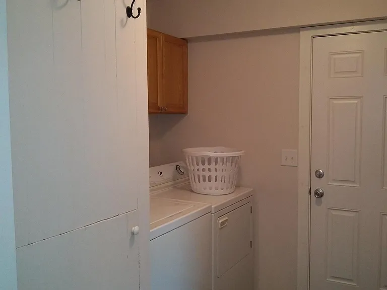 Laundry area with washer and dryer included.