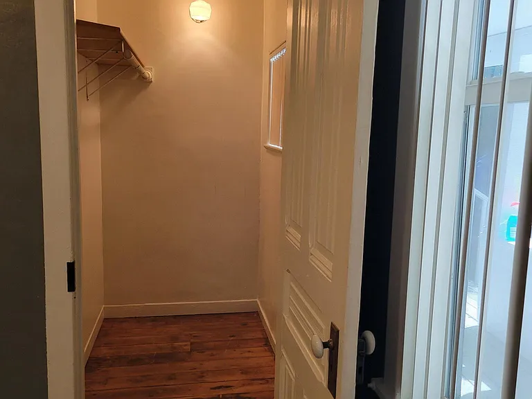 walk in closet with an operational window
