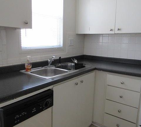 Kitchen has dishwasher, range, overhead microwave and genero