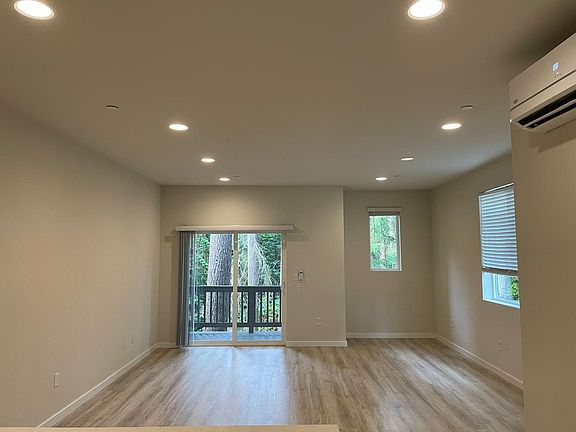 living room with a/c and private deck