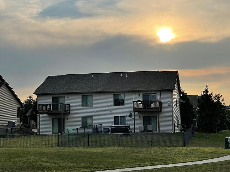 House on the right. View of the back yard and deck. Fire pit in the middle of the yard

*Hot tub not included*