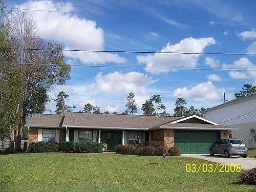 Front view of the house, big front yard