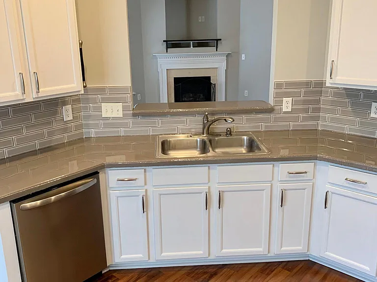 Picture frame opening over the kitchen sink with view of fireplace/living room.....